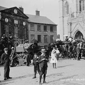 Horse buses in front of the Cathedral, High Cross, Truro, Cornwall. Around 1910