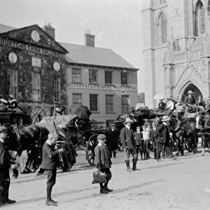 Horse buses in front of the Cathedral, High Cross, Truro, Cornwall. Around 1910