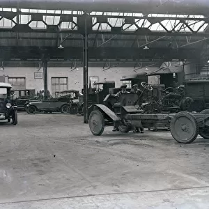Interior of Princes Garage with vehicles and workers, H. T. P. Motors Ltd, Truro, Cornwall. Early 1920s