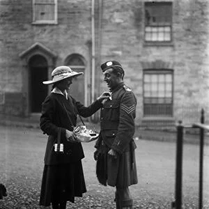 Lady and soldier on Flag Day, Boscawen Street, Truro, Cornwall. 18th October 1916