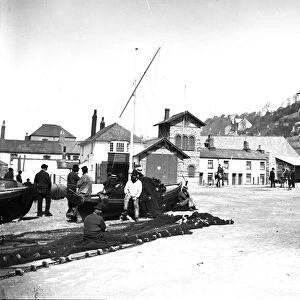 The Lifeboat station and neighbouring buildings viewed from the quayside, East Looe, Cornwall. After 1891