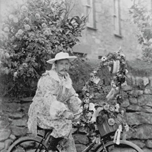 Samuel John Govier posed in fancy dress on his bicycle, locality unknown but somewhere in West Cornwall. Early 1900s