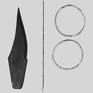Slate Knife and bronze rings from the Iron Age cemetery at Harlyn Bay, St Merryn, Cornwall. 1900