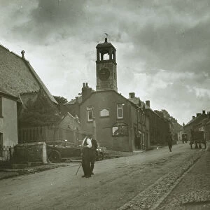 Town Clock and Major Gills car, Grampound, Cornwall. Around 1925
