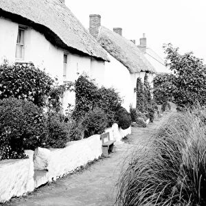 View along the row of cottages near the beach, Porthoustock, St Keverne, Cornwall. 1912