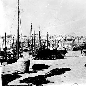 View along Smeatons Pier towards the town, St Ives, Cornwall. Around 1900