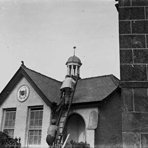 Workmen finishing the roof of the public toilets on Lemon Bridge at the bottom of Lemon Street, Truro, Cornwall. The toilets opened in September 1925