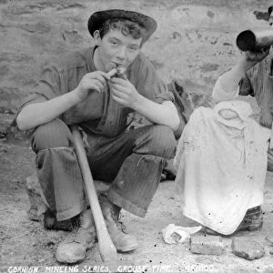 Two young miners at croust time at an unidentified mine in Cornwall. Late 1800s