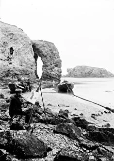 Images Dated 12th October 2018: Artist at Arch Rock, Perranporth, Perranzabuloe, Cornwall. Early 1900s