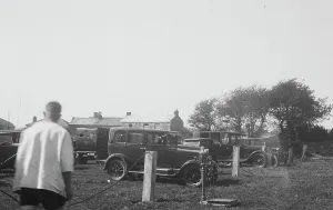 Cars parked in a field for a Cornish wrestling match at an unknown location, Cornwall. Around 1930s