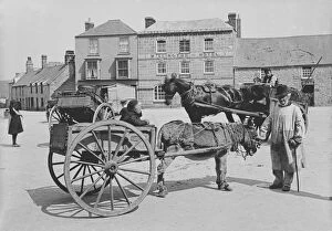 Images Dated 1st April 2019: A donkey and cart in Market Square, St Just in Penwith, Cornwall. Early 1900s