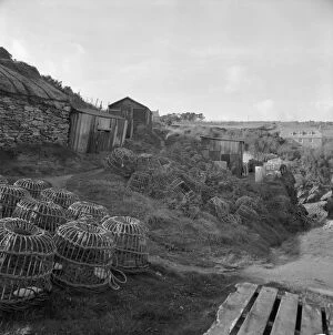 Images Dated 19th February 2018: Fishermens huts and lobster pots, Prussia Cove, St Hilary, Cornwall. 1970