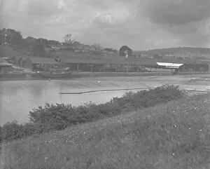 Images Dated 7th April 2018: Harveys Timber Yard taken from the Malpas Road side of the Truro River, Truro, Cornwall. Early 1900s