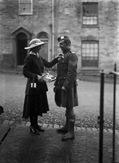 Images Dated 4th March 2016: Lady and soldier on Flag Day, Boscawen Street, Truro, Cornwall. 18th October 1916