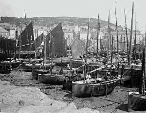 Images Dated 25th March 2019: Mousehole harbour looking landward, Cornwall. Early 1900s