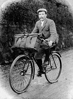 Govier Collection: Samuel John Govier on his bicycle with his photographic box on the front, Cornwall. Early 1900s