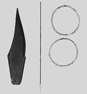 Images Dated 19th September 2019: Slate Knife and bronze rings from the Iron Age cemetery at Harlyn Bay, St Merryn, Cornwall. 1900