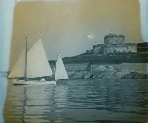 St Mawes Collection: St Mawes Castle from the estuary with a yacht, Cornwall. Around 1925